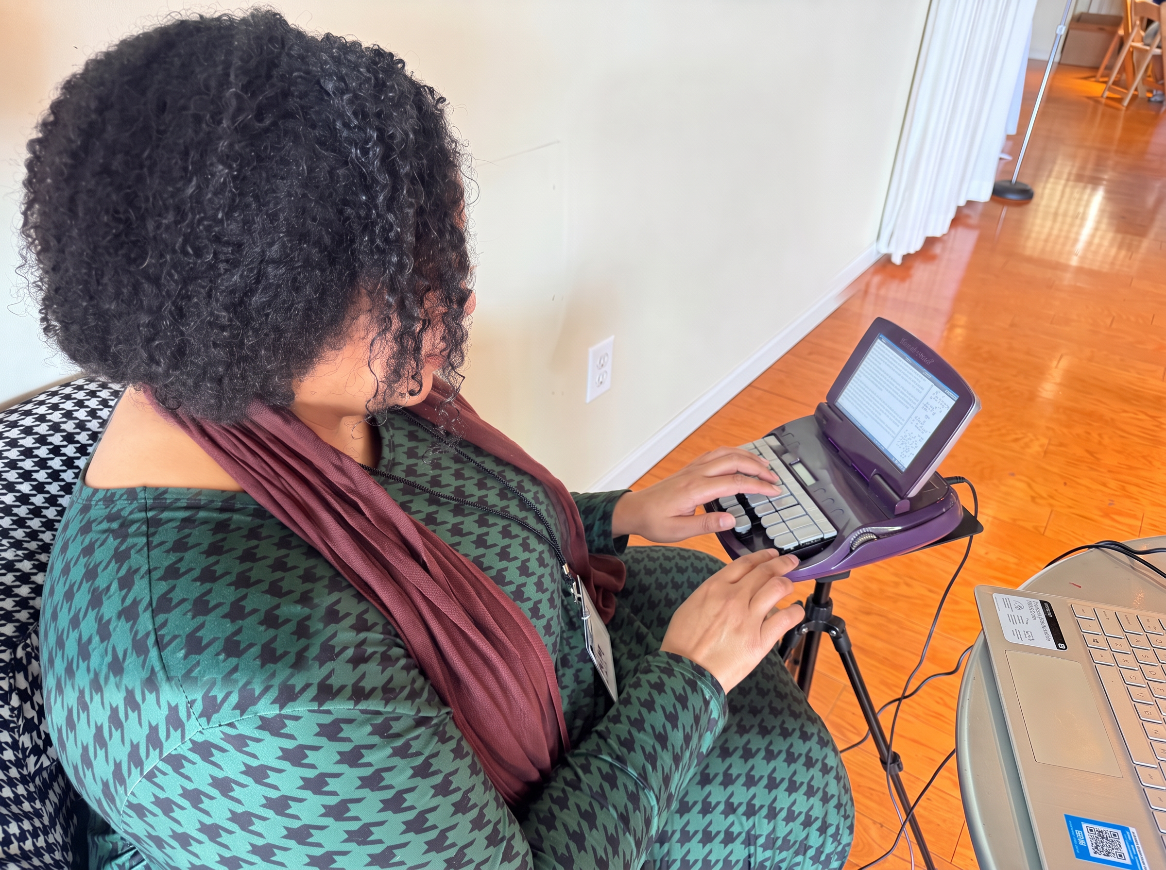 Teri C. Gibson at a CART job using stenography to provide Projection CART